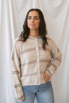 Krista Striped Sweater Cardigan in Beige Multi with classic neutral stripes and rolled-edge details.