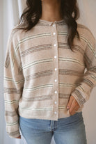 Krista Striped Sweater Cardigan in Beige Multi with classic neutral stripes and rolled-edge details.