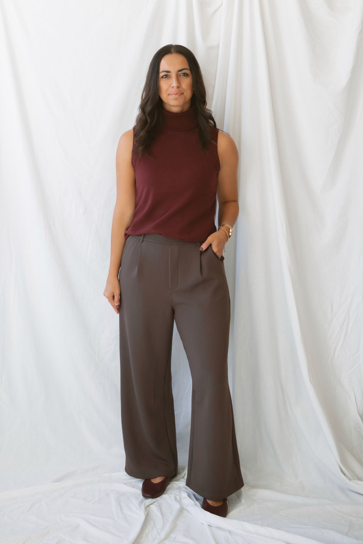 Model wearing the ribbed tailored trousers. 