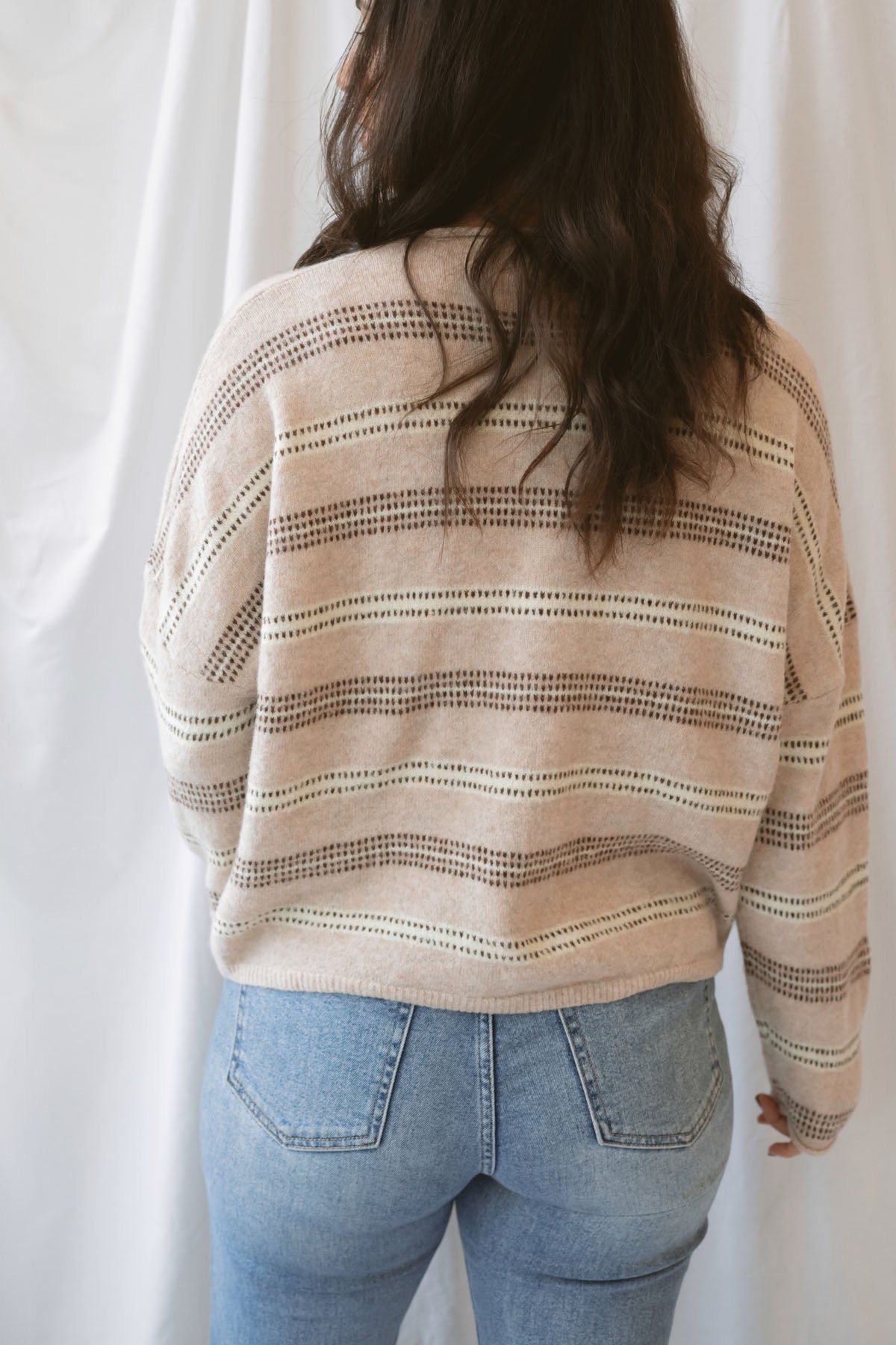 Krista Striped Sweater Cardigan in Beige Multi with classic neutral stripes and rolled-edge details.