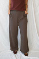 Model wearing the ribbed tailored trousers. 