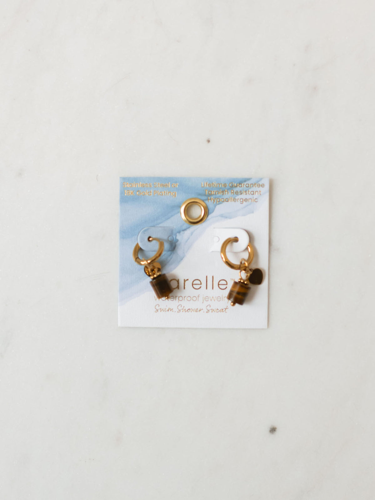 Tiger eye pendent with heart charm on gold hoops. 