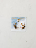 Tiger eye pendent with heart charm on gold hoops. 