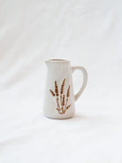 Style 3 of the mini floral pitcher. Set up against a white linen backdrop. 