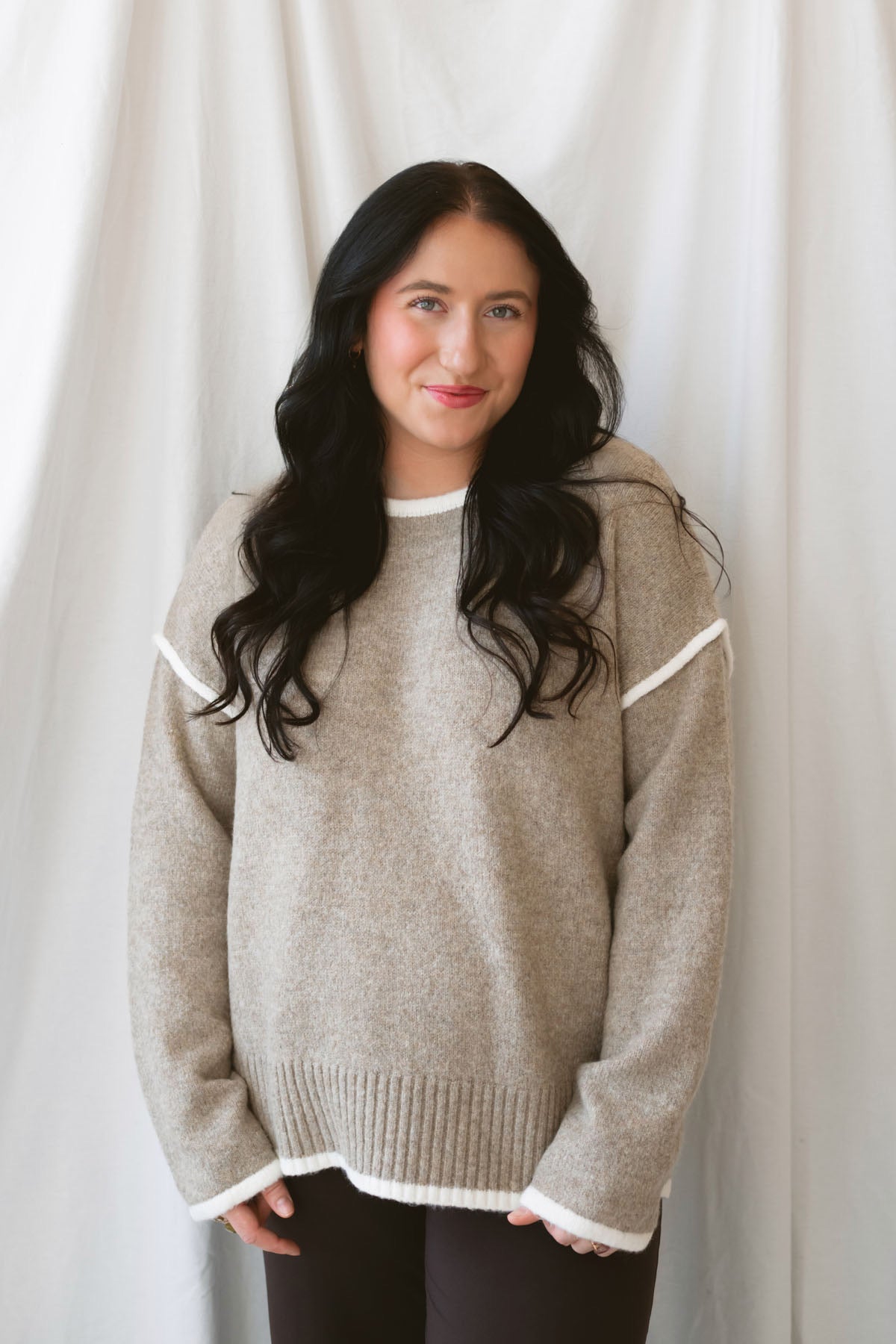 Juliana light mocha knit sweater top with long sleeves, contrast trim, and side slit hem.