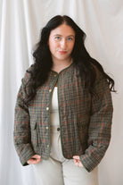Kenzie Houndstooth Jacket in Olive Multi featuring an olive-toned houndstooth pattern and contrasting binding.