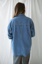 Model is wearing the oversized denim lightweight jacket. 