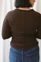 Honey Coffee Bean long sleeve micro-ribbed Henley top with a classic button-front neckline.