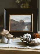 Small woodgrain brown pumpkin styled with other small pumpkins in our antique gold leaf bowl 