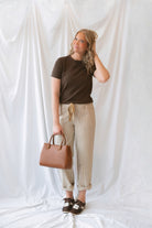 Steph Striped Wide Leg Drawstring Pants in Warm Sand Stripe featuring a relaxed silhouette and neutral striped pattern.