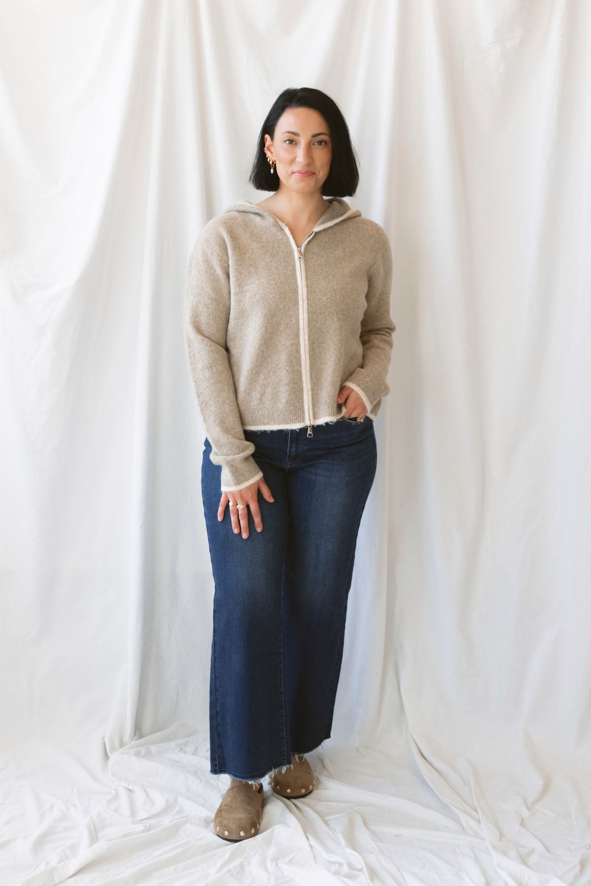 Ginger mocha knit hooded cardigan with contrast trim, long sleeves, and a front zip closure.