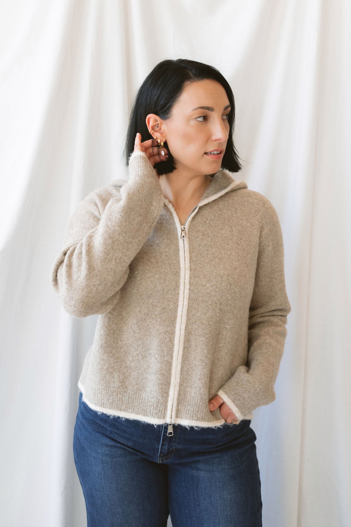 Ginger mocha knit hooded cardigan with contrast trim, long sleeves, and a front zip closure.