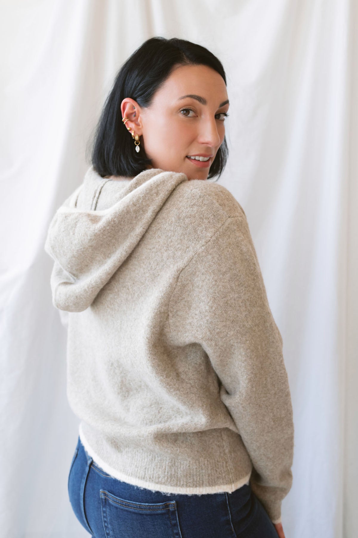 Ginger mocha knit hooded cardigan with contrast trim, long sleeves, and a front zip closure.