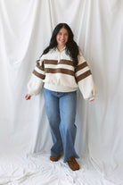 Lottie rugby-inspired pullover featuring horizontal cream and camel stripes.