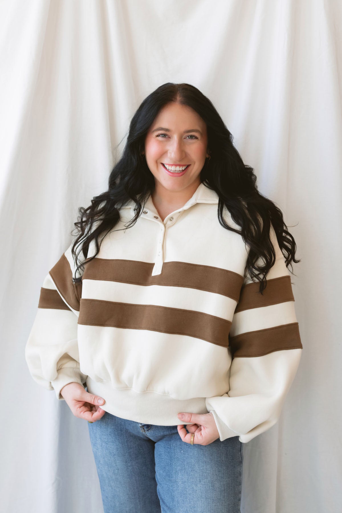 Lottie rugby-inspired pullover featuring horizontal cream and camel stripes.