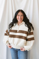 Lottie rugby-inspired pullover featuring horizontal cream and camel stripes.