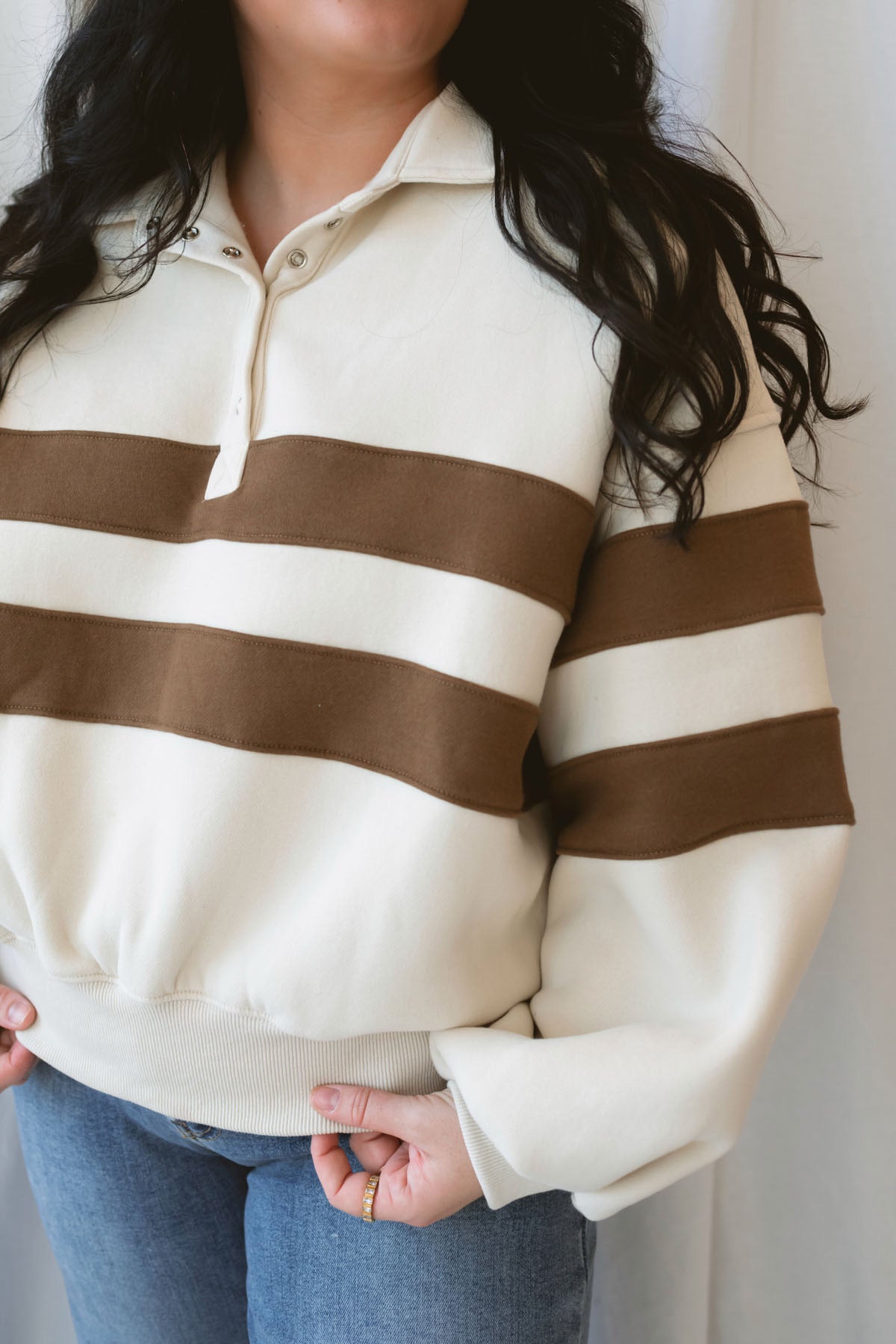 Lottie rugby-inspired pullover featuring horizontal cream and camel stripes.