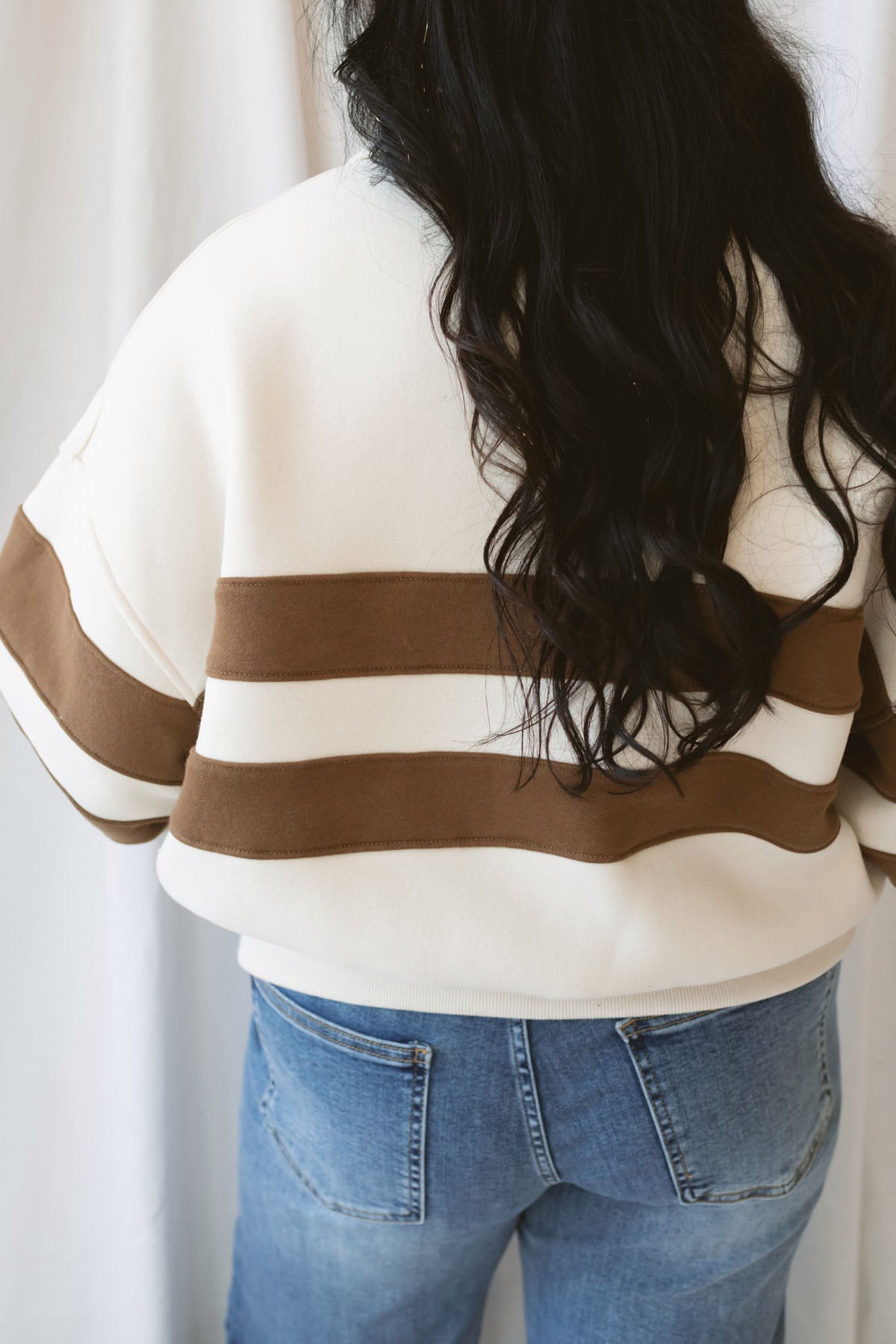 Lottie rugby-inspired pullover featuring horizontal cream and camel stripes.