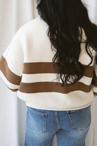 Lottie rugby-inspired pullover featuring horizontal cream and camel stripes.