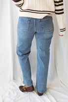 Devan full length straight leg jeans in medium denim with a classic five-pocket design and versatile straight-leg silhouette.