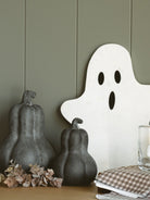 The medium and large gourds are styled together with a marble ghost shaped board and a small eucalyptus style sprig. 