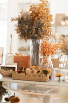 Light brown thistle spray styled with other warm tones and fall stems. 