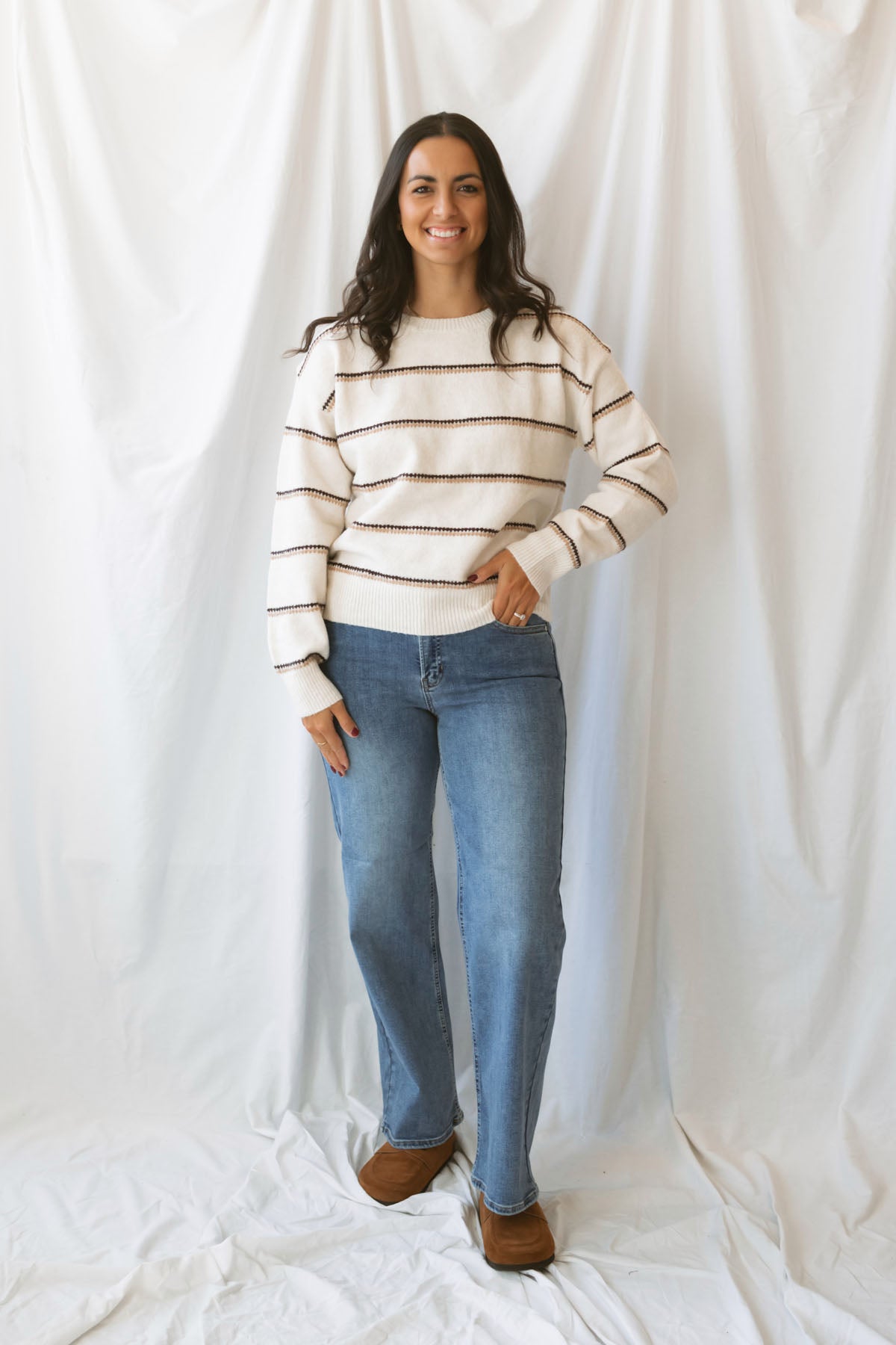 Winona oatmeal striped crew neck sweater with long sleeves and a classic knit design.