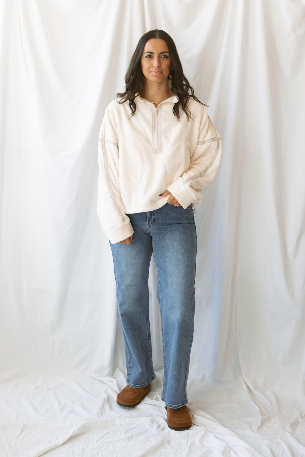 Fiona ivory half zip fleece pullover with contrasting trim details and long sleeves.