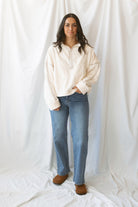 Fiona ivory half zip fleece pullover with contrasting trim details and long sleeves.