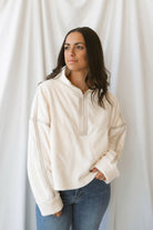 Fiona ivory half zip fleece pullover with contrasting trim details and long sleeves.