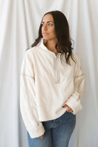Fiona ivory half zip fleece pullover with contrasting trim details and long sleeves.