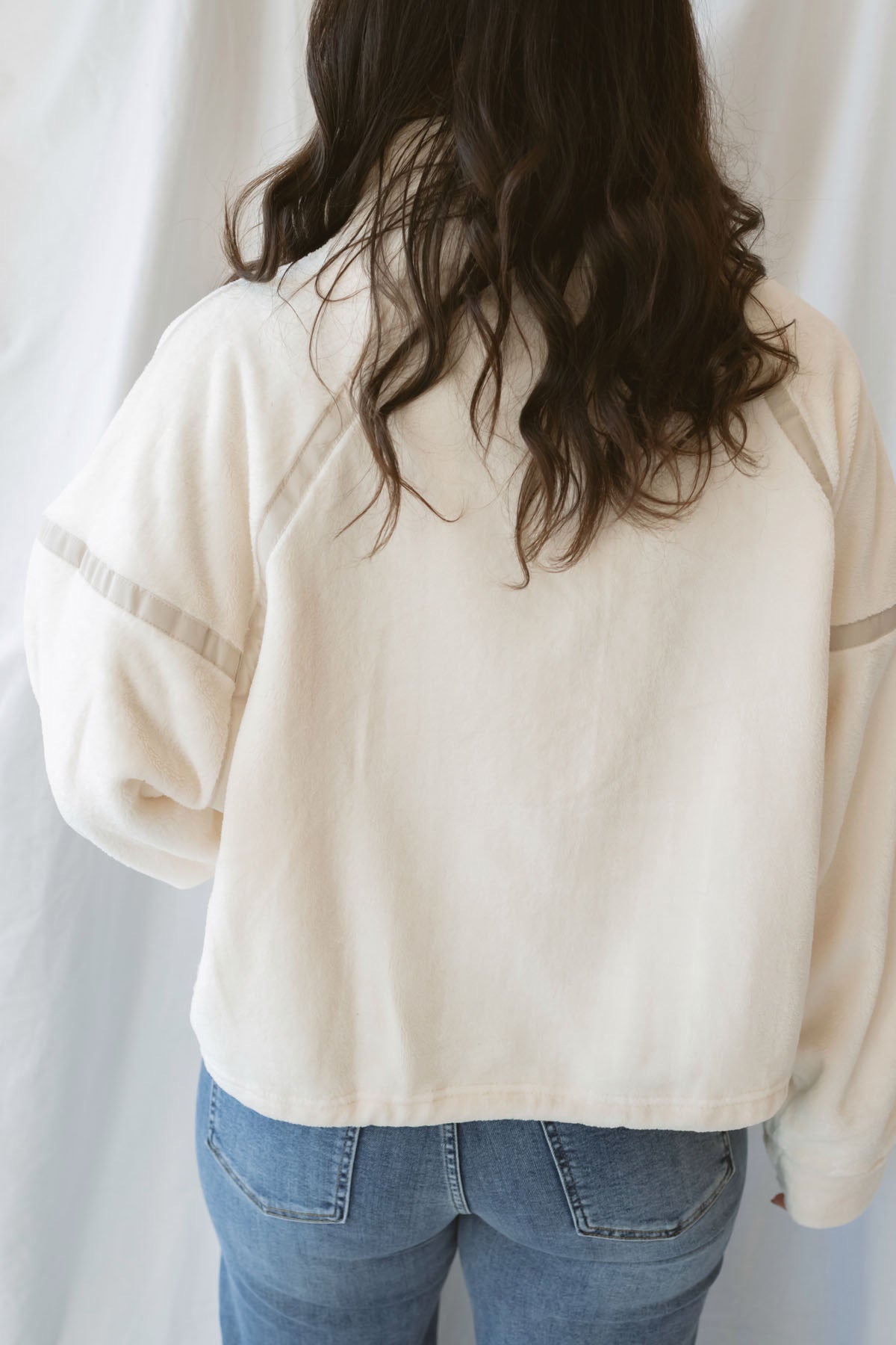Fiona ivory half zip fleece pullover with contrasting trim details and long sleeves.