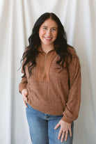 Valerie brick ribbed knit half zip pullover sweater with long sleeves and a cozy textured design.