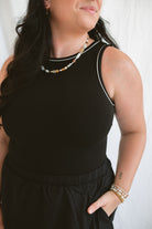 Model wearing the sleeveless piping knit contrast detail midi dress