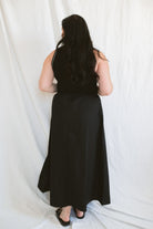 Model wearing the sleeveless piping knit contrast detail midi dress