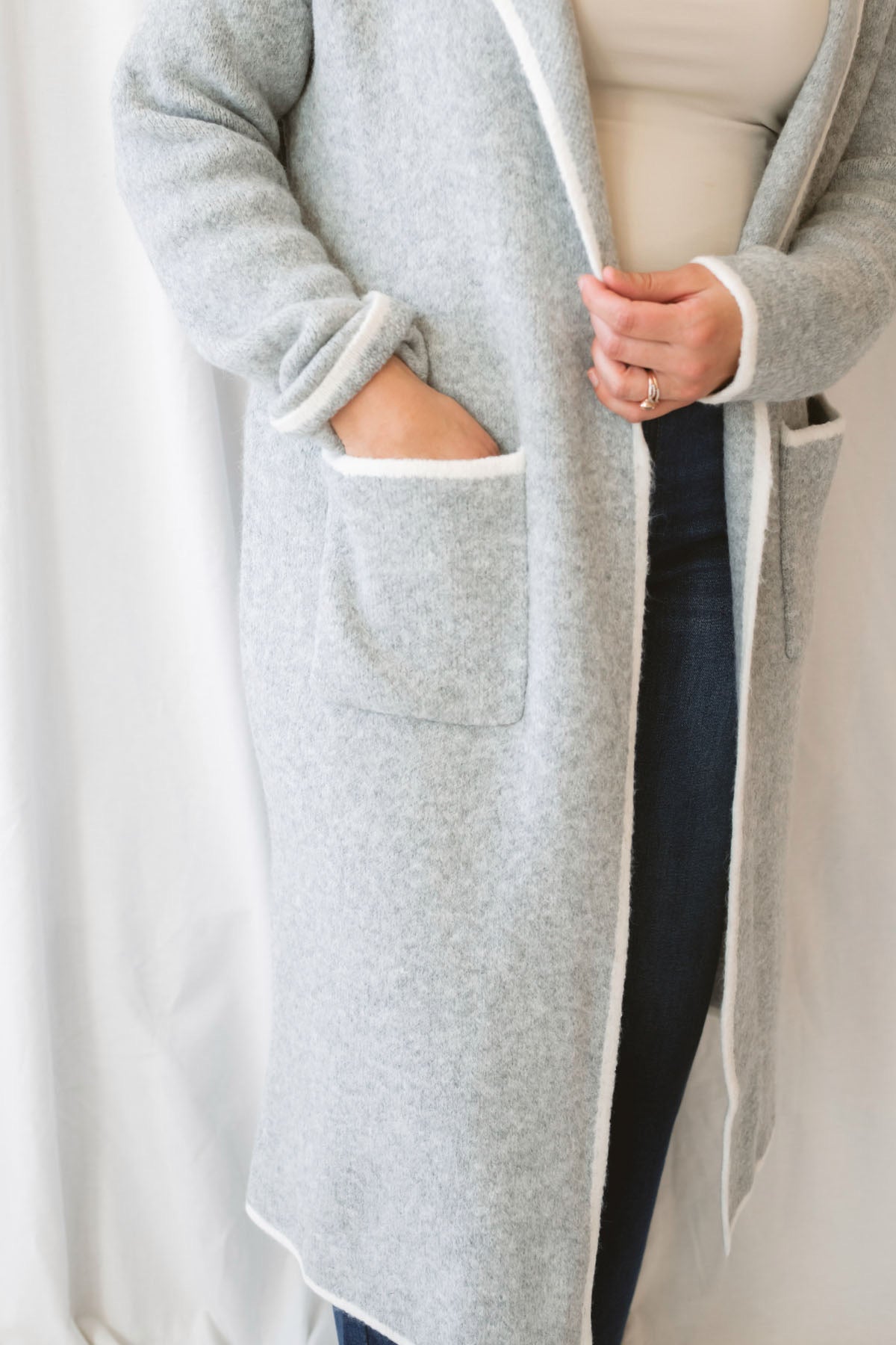 Kaitlyn heather grey knit open cardigan with a lapel collar and contrast trim.