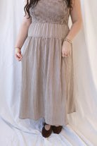 Willow brown gingham sleeveless midi dress with a smocked bodice and tiered skirt.