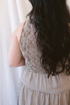 Willow brown gingham sleeveless midi dress with a smocked bodice and tiered skirt.