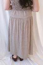 Willow brown gingham sleeveless midi dress with a smocked bodice and tiered skirt.