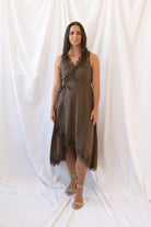 Sadie brown midi dress with a V-neck surplice front, lace trim, and tie waist.