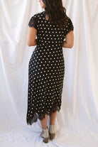 Joanna black polka dot midi dress featuring short sleeves and delicate lace trim detailing.