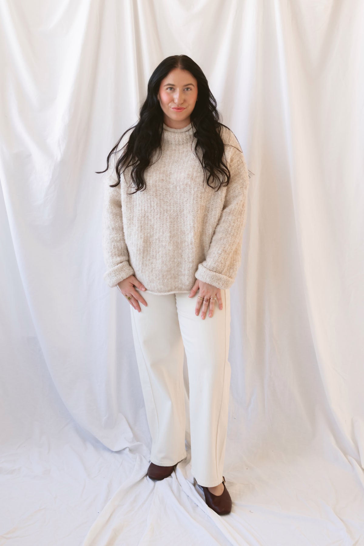 Emily oatmeal fuzzy knit sweater with a raw-edge mock neckline and long sleeves.