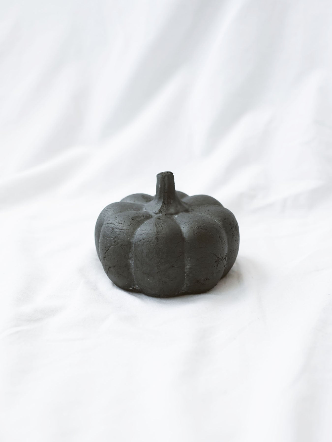 Smallest size of the 3 styles sitting on a white linen backdrop. 