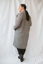 Model wearing the millie coat over an all black base. Lightweight and versatile. 