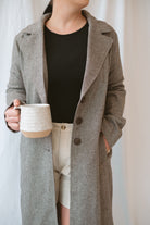 Model wearing the millie coat over an all black base. Lightweight and versatile. 