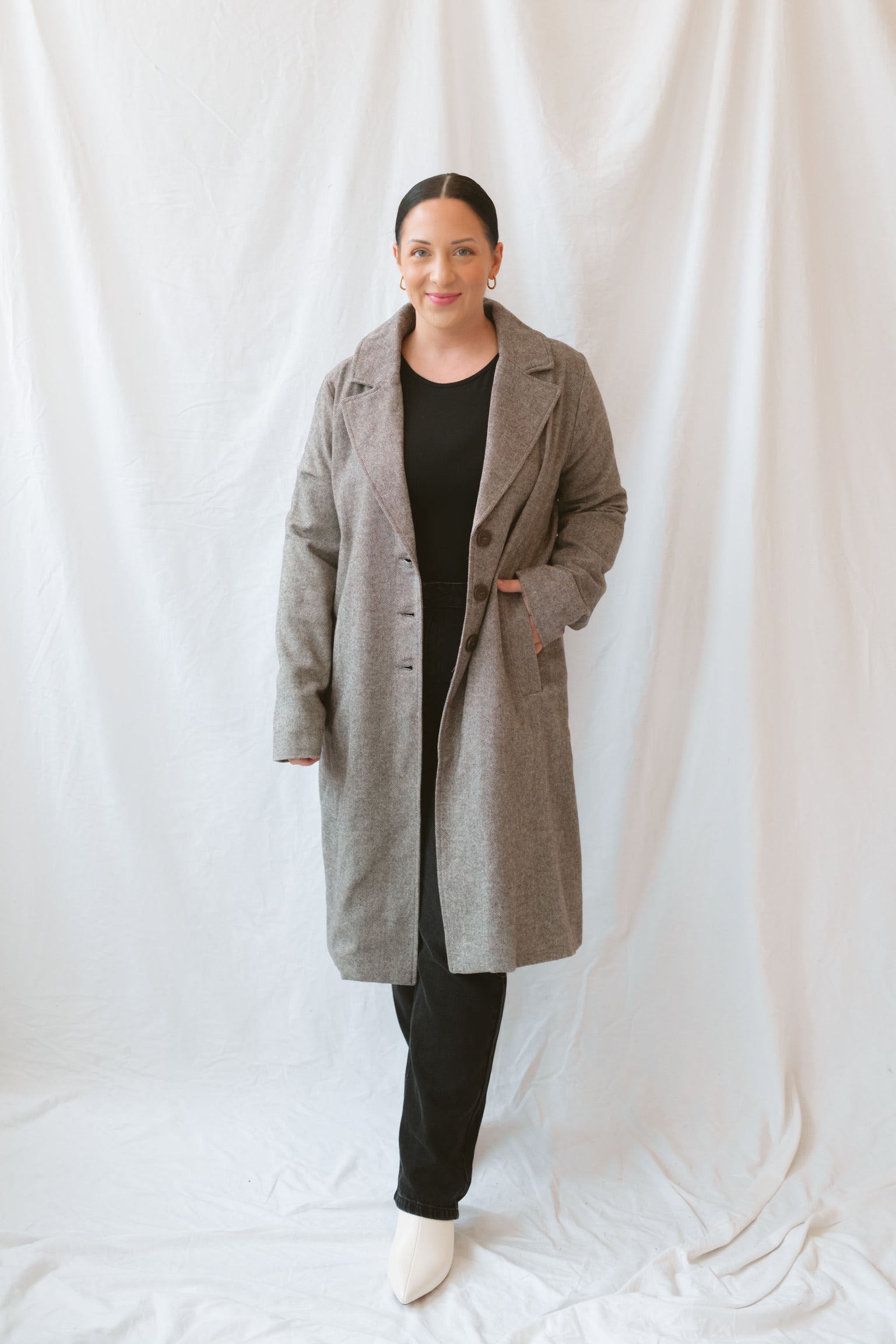 Model wearing the millie coat over an all black base. Lightweight and versatile. 